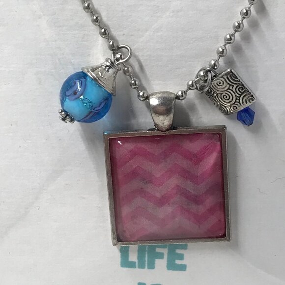NEW Pendent necklace with pink pendent and 2 charms.  Comes on a 22 inch chain - Picture 2 of 6